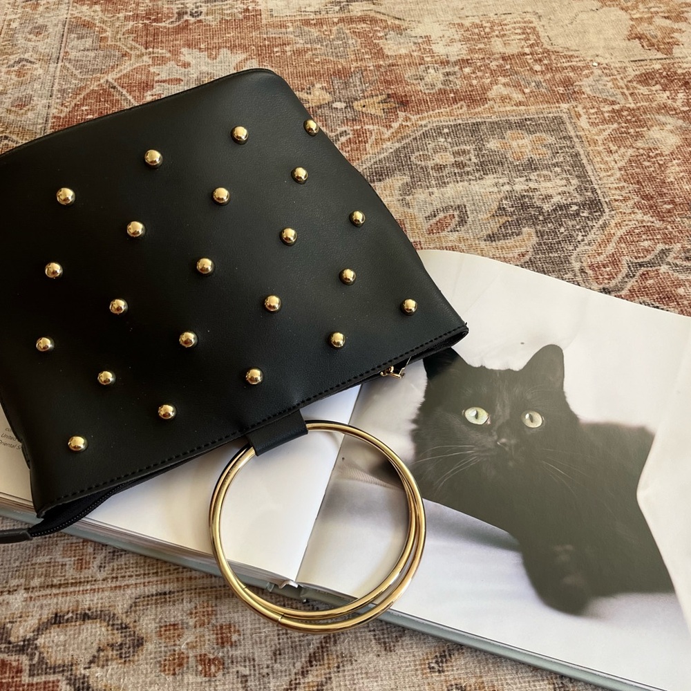 Melie Bianco studded clutch purse